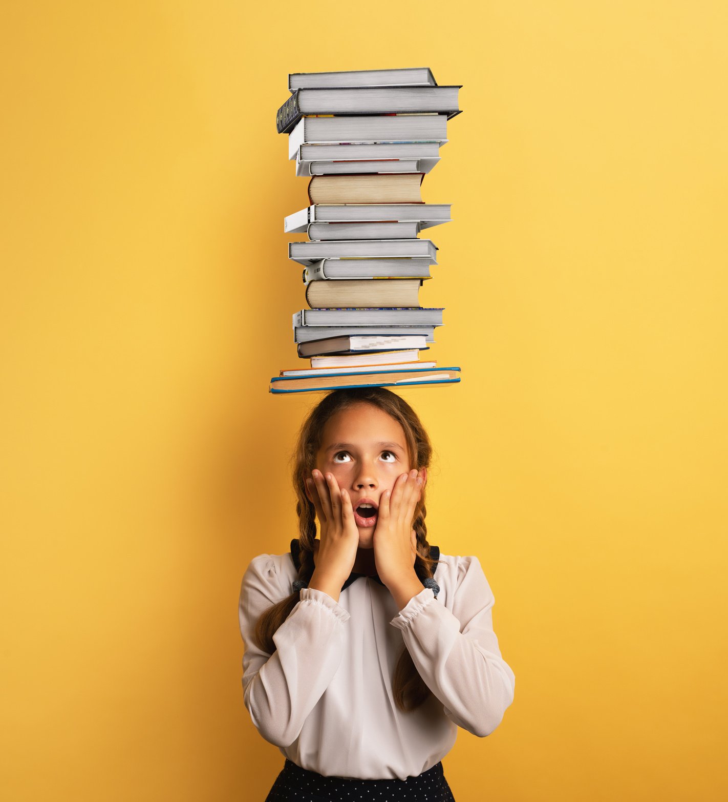 Young Child Student Worried Due to Too Much Books to Read and Study. Yellow Background